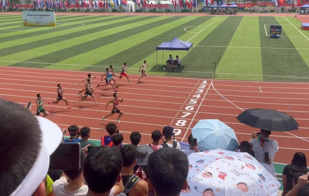 全国大学生田径锦标赛：邓信锐、严海滨先后打破男子100米赛会纪录